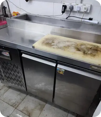 Stainless steel counter chiller in a commercial kitchen